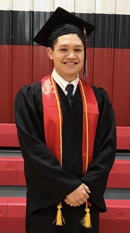 Graduation cap and gown photo of Justin Heath